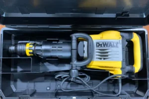 Yellow and black DeWalt 35lb demolition hammer in tool case.