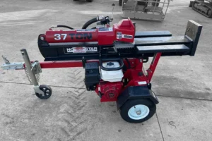 Red NorthStar 37-ton log splitter parked outdoors.