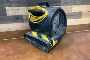 Black carpet turbo fan used to dry floors quickly