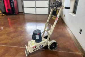 Echo tile remover machine on a polished concrete floor in an indoor setting