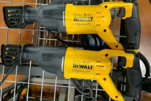 Two DeWalt Sawzalls with yellow and black design on a metal shelf